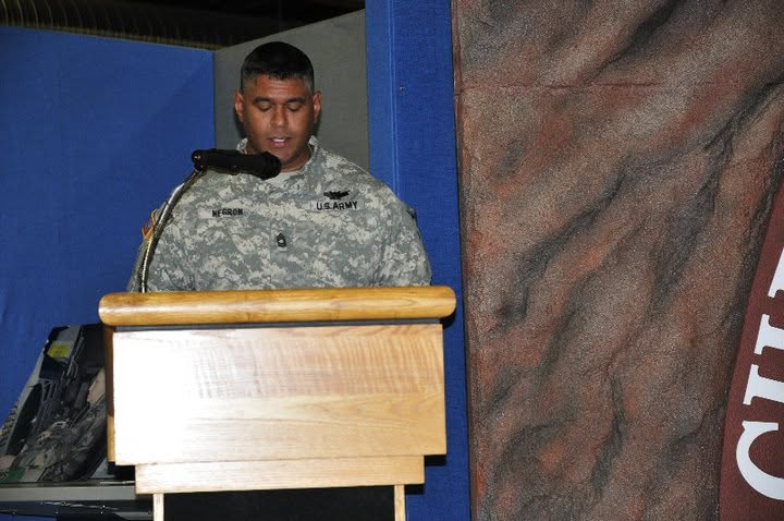 Eddie Negrón speaking at podium